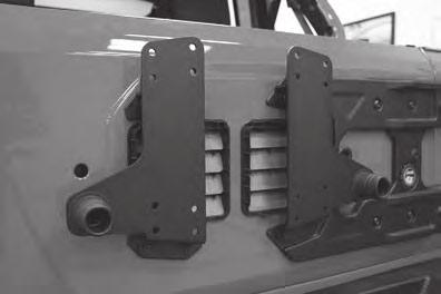 10 Figure 10 Identify the Left and Right Upper Brackets. Using the original hardware, bolt the upper brackets to the tailgate.