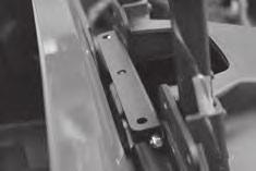 Using original hardware, bolt the main brackets to the tailgate at the lower attachment points. Leave hardware slightly loose for future adjustments.