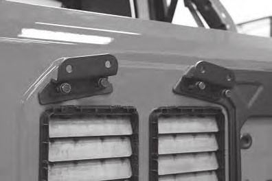 12 Figure 12 Lower Height Position: Lower set of holes Using provided 8mm x 35mm bolts, washers and nylock nuts, install factory tire carrier to new