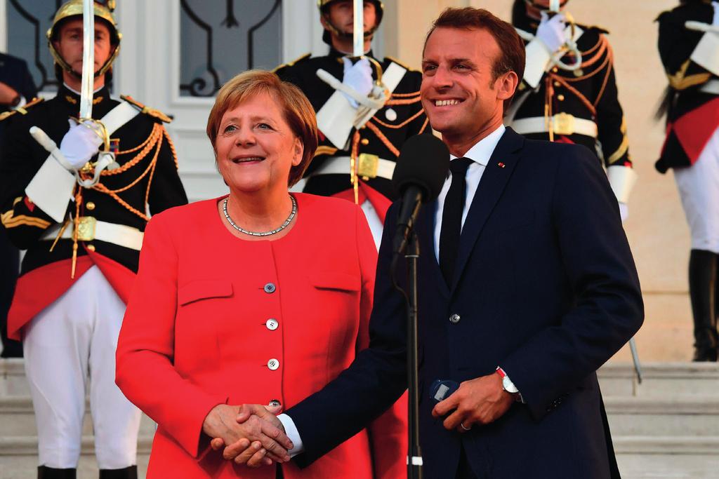 Tysk-fransk axel. Förbundskansler Angela Merkel och president Emmanuel Macron talar för en gemensam budget i euroområdet. varliga ekonomiska chocker.
