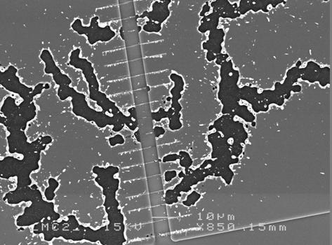 4.2. Growth conditions Figure 4.3: Discharge destruction of sample surface from growth at a partially isolating substrate in process A. hence removes the discharge problem.