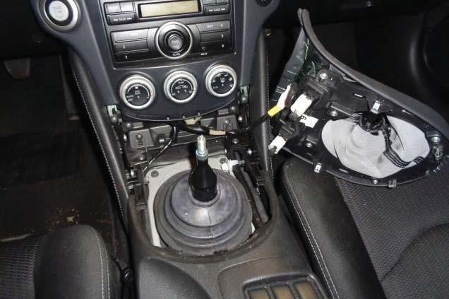 While holding the shift lever stationary, remove the