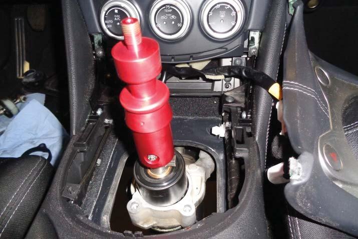 opening in the shifter housing as shown