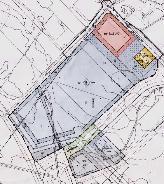 I den gällande planen hindras utbyggnad av befintliga ledningar och restriktioner i form av delområden som inte får bebyggas eller endast får bebyggas med bostäder och kontor.