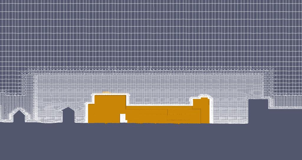Figur 3: Den aktuella byggnaden i Scenario 1 samt konturerna från omgivande byggnader sett från sydväst. Beräkningsnätet förfinas stegvis närmre geometrierna.