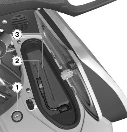 z Översikt Förvaringsfack 1 Spärr (se motorcykelns instruktionsbok) 2 Anslutning för USB-kontakt