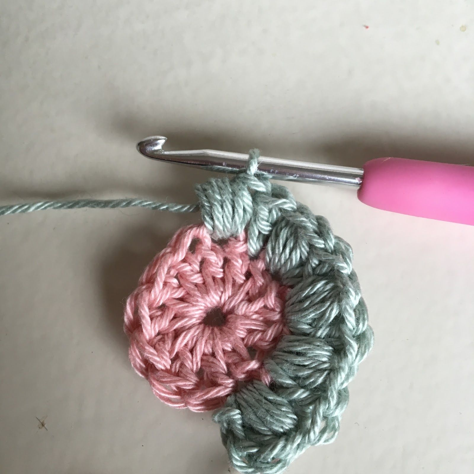 Yarn over and insert your hook into the specified stitch.