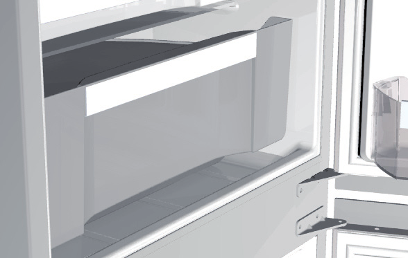 Lyft upp bakre delen av hållaren och dra den mot dig. Placera hållaren i kylskåpet på ett sådant sätt att du obehindrat kan stänga kylskåpsdörren. Max.