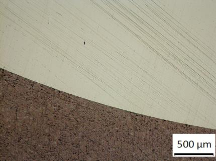 The white areas in the deposit contain Pb.