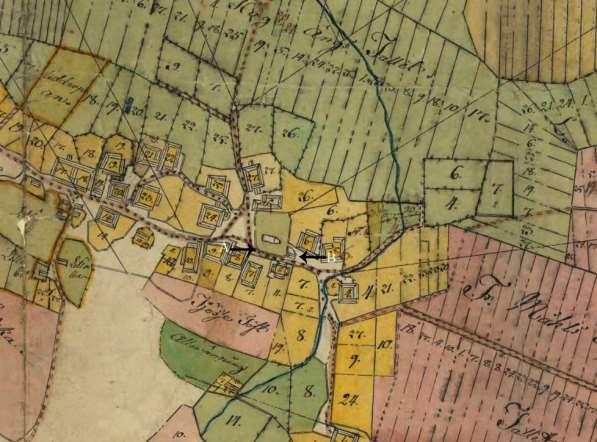 Figur 10. Del av enskifteskartan från 1803, pil A markerar den äldre vägsträckningen som låg intill kyrkogårdsmuren, pil B den mindre byggnad som kan ha samband med grop A 272.