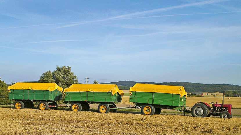 Veteskörd i Skåne MF 35 drar 21 ton Veteskörd i Skåne. En MF35 23C, årsmodell 1958, med tre stycken Skånska Lantmännens sju tons vagnar = 21 ton.