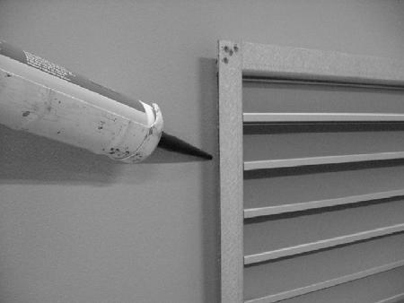 For the hole-punching dimensions in the wall for AWY and the drilling dimensions for AWB, see Appendix C. 2. Fit AWYs' inner section to the wall with the arrow upwards, see Figure 1.