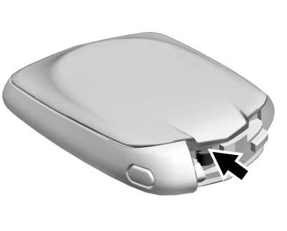 NYCKLAR, DÖRRAR OCH FÖNSTER 33 2. Separera sändarens två halvor genom att föra in ett platt verktyg i mitten av nederdelen. Använd inte nyckelhålet. 3. Tag ur det gamla batteriet.
