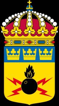 32. Försvarsmaktens tekniska skola (FMTS) I fält av purpur ett stolpvis ställt svärd lagt över ett
