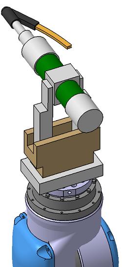 Figur 39 Roboten håller i skruvdragare med hjälp av gripdon Detta gripdon utför även hanteringen av de kontaktdon som monteras på skåpets baksida.