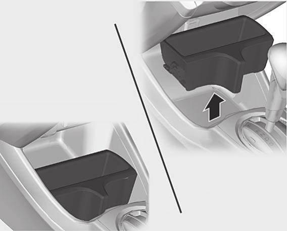 Kupékomfort Främre konsolfack Låda under säte Solskydd AVDELARE Öppna Stäng På modeller med en avdelare i det främre konsolfacket Du kan ta bort avdelaren för att förvara större föremål.