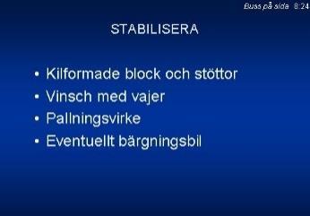 8:23 Blockens funktion är förutom att låsa bussens rörelser i längdriktningen, att ge mothåll mot krafterna i vinschens vajer och medverka till att bussen, vid kommande lyft också höjs på den sida