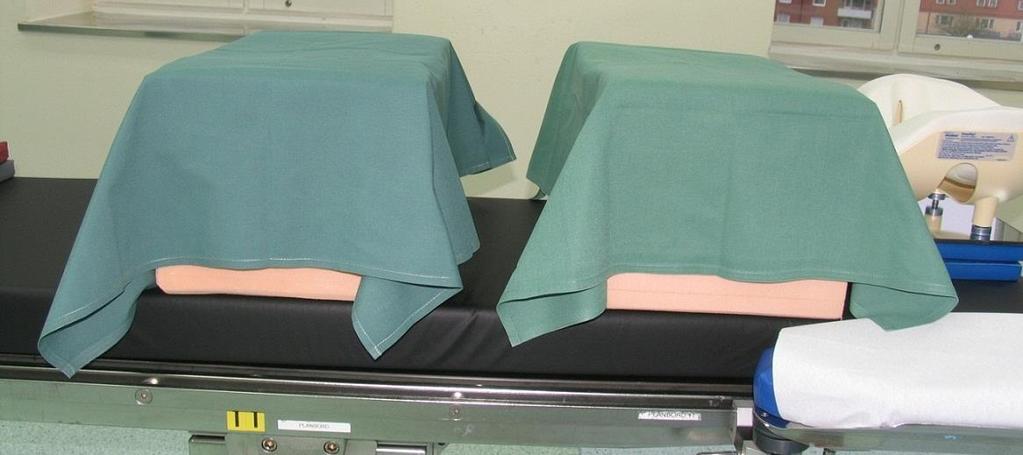 Små gröna lakan för att lyfta patienten vid justering av läget. Söv på valfritt operationsbord och genomför en säker överflyttning.
