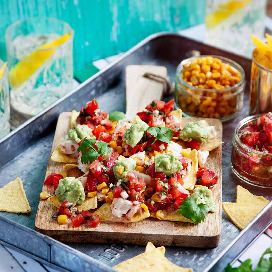 FISH TACO med tomatsalsa, rostad majs och guacamole port.