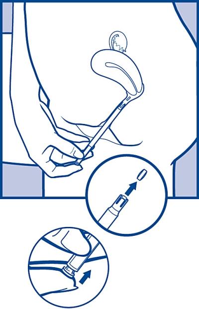 3. För att lösgöra tabletten, tryck lätt på tryckknappen tills du känner ett klick.