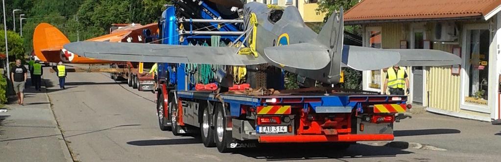 propeller-, segel-, och jetflygplan från olika förvaringsplatser till ett nybyggt magasin i