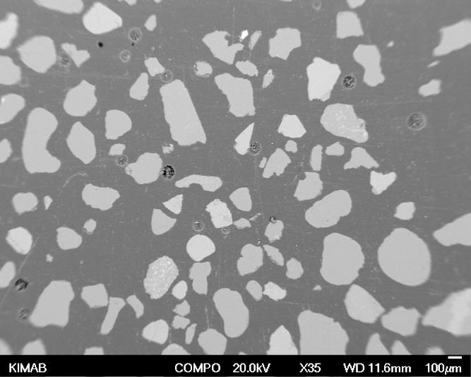 Agglomerated grains are indicated by arrows.