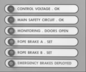 Control voltage dioden ska vara upplyst. Tryck på nödstoppsknappen. Bromsarna kommer omedelbart avmagnetiseras och låsa hissen. Kontrollera att båda bromsarnas lysdioder har släckts.