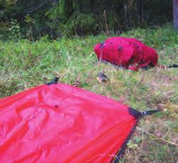 Lay out the poles, and put the tt and pole bag in your pocket or pack so they do not blow away during set up.