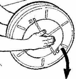 Lift the tangs on the drum by a screwdriver and rotate the spring housing centre in order to release it from the drum. Fig. 7. Turn the drum upside down, Fig.