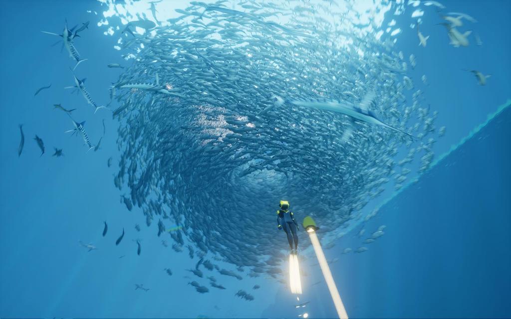Figur 2 Skärmdump från spelet ABZÛ som visar ett stort antal fiskar som befinner sig i ett stim.