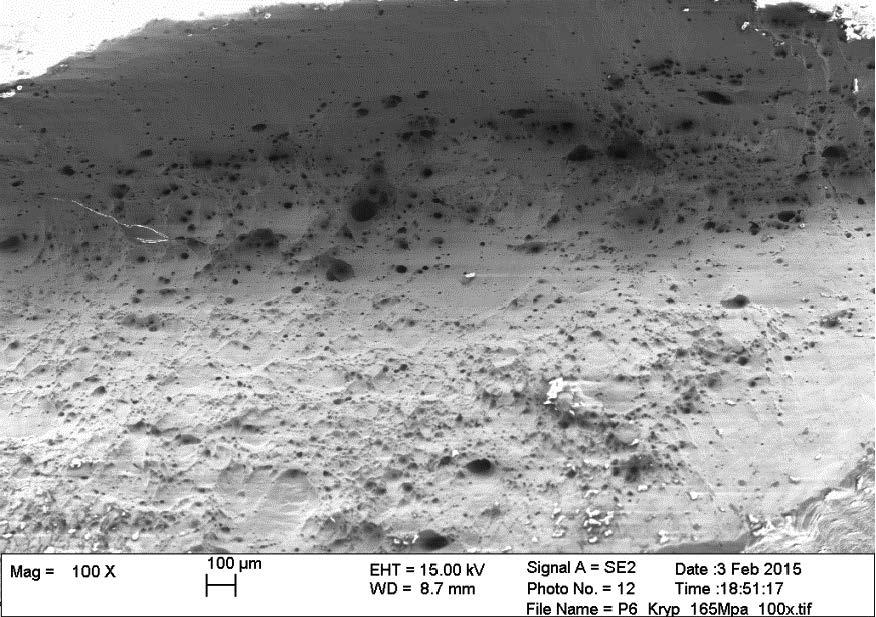 At higher magnification, Figure 4 4, it can be seen that all cavities are lengthened in the main creep direction (perpendicular to the paper).