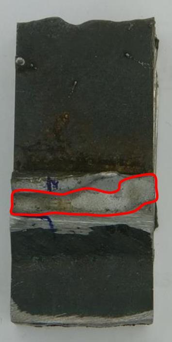Figure 11, A hot crack that has been broken open, the crack is marked with the red line The SEM-analysis from the specimen can be seen in Figure 12.