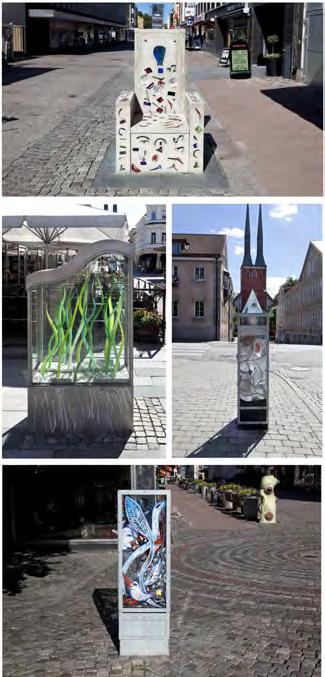 2 Glasgatan, Sandgärdsgatan För att få fler människor att röra sig längs Sandgärdsgatan kom Karl-Johan Krantz och Ulf Agermark med idén att låta några av nutidens mest framstående glaskonstnärer