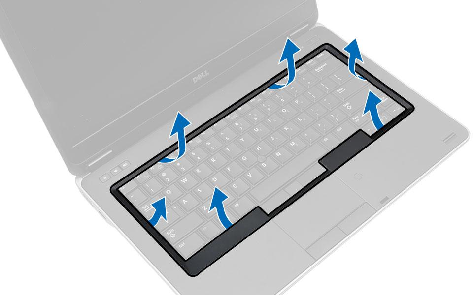 3. Använd en plastrits, bänd upp tangentbordsramen för att frigöra den från datorn. Lyft upp för att ta bort tangentbordsramen från datorn. Installera tangentbordsramen 1.