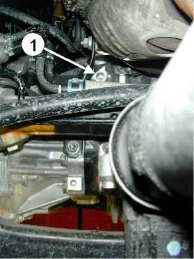 Remove the engine compartment undertray. Fit the heater in the original hole (1). Let the black plug-in contact point at 9 o clock. Thoroughly clean the area where the heater is to be placed.