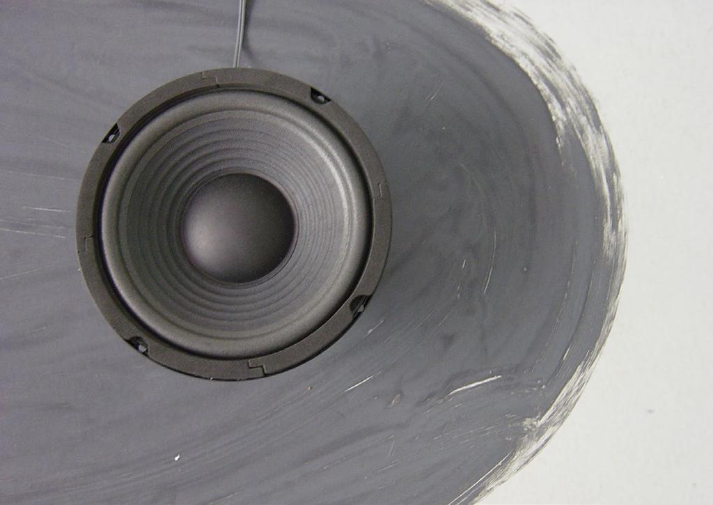 The speakers are moving slowly up and down, as a lung, or a heart. They are dead silent, no sound is heard.