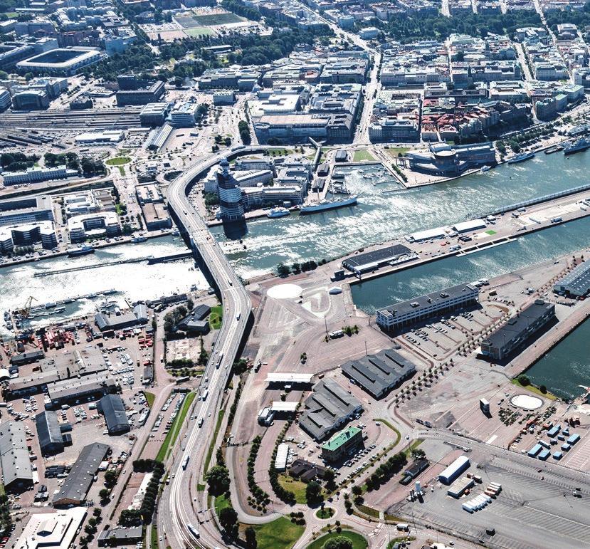 FRIHAMNSPLATSEN, MITT I NYA FRIHAMNEN Frihamnsplatsen och områdets framväxt Framtidens Kyrka vetter mot Frihamnsplatsen där Frihamnens övergripande stråk möts och som bildar entré till