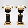 Slutpris: 5 200 SEK 145 TAZZOR, ETT PAR - CHARLES X. Frankrike, brännförgylld och svartpatinerad brons, höjd 30,5 cm, diameter 18 cm. Insatsskålar saknas/ The inserts are missing.