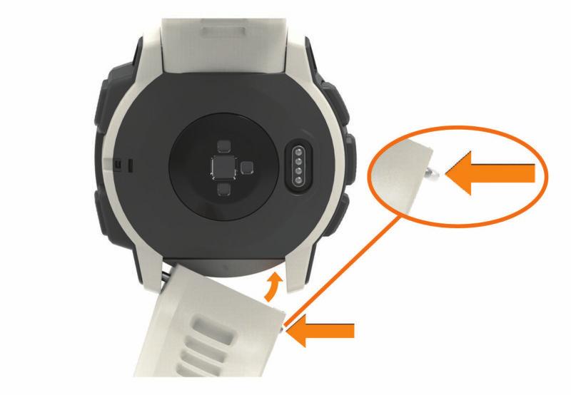 3 Välj ett alternativ: Om du vill installera Instinct band passar du in ena sidan av det nya bandet med hålen på enheten, trycker in det synliga stiftet på klockan och trycker bandet på plats. Obs!