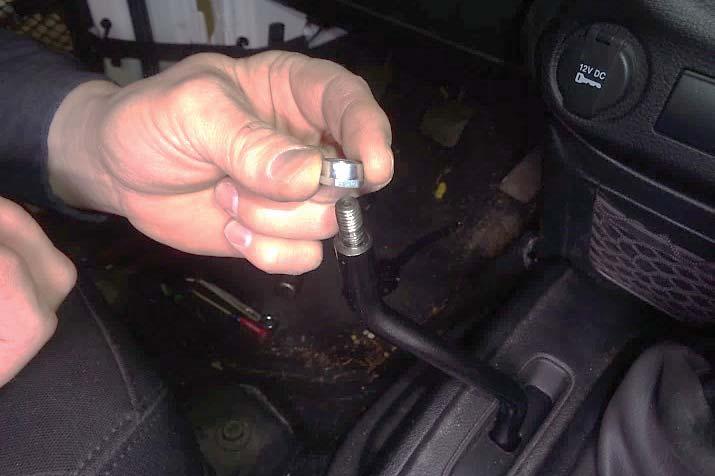 Install the jam nut (2) on the shift lever, with the wrench flats down.