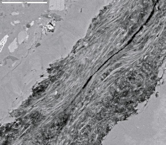 704.00 704.30 m: Sample type: Thin section. Rock type: Greenstone (?). Fracture: One closed fracture with a thickness of 2 3 mm. Minerals: Prehnite, Epidote, K-feldspar, Apophyllite, Clay mineral (?). Order: 1) Epidote (idiomorphic) filled fracture coated by idiomorphic K-feldspar.