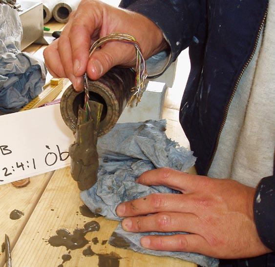 Figure 5-2. Clay and/or drill cuttings in overcored sample for test no. 2:4:1 (153.74 m borehole length). Figure 5-3. Strain gauges after dismantling from overcore sample for test no. 2:1:2 (150.