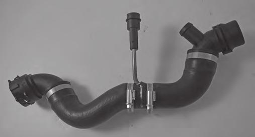 Place the hose in position again and fix the heater in its correct position, see picture 4.