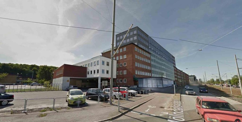 Fasad över föreslagen bebyggelse mot Mölndalsvägen, version påbyggnad med kontorsbyggnad i tre plan. Sett från söder. Mölndalsvägen till höger i bild. Illustration av Krok & Tjäder.