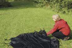 line of elastic loops near the middle of the tent and seat the pole end into the
