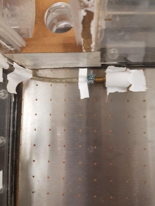 Figure 9: Setup of the hose for extra fluidization shown in the cold flow model combustor chamber when no bed material is added.