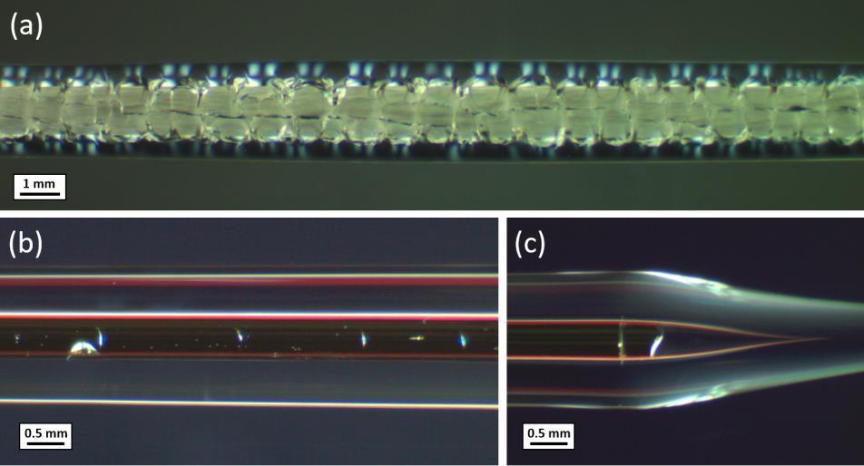 51 ruby and sapphire rods of 1 mm in diameter within a 6 mm silica tube. One such taper that resulted in a relatively stable OD is shown in Fig. 5.10(a).