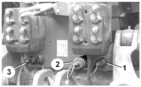 Idrifttagningr 6.2.1 Inställning av systemomställningsskruv på spridningsventilblock Bild 32/.