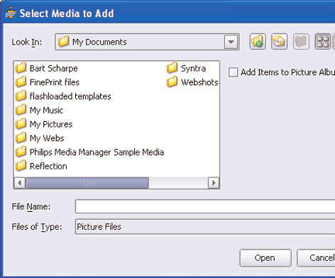 Välj Add Music, Add Pictures eller Add Movies. Klicka på Add Files or Folders.