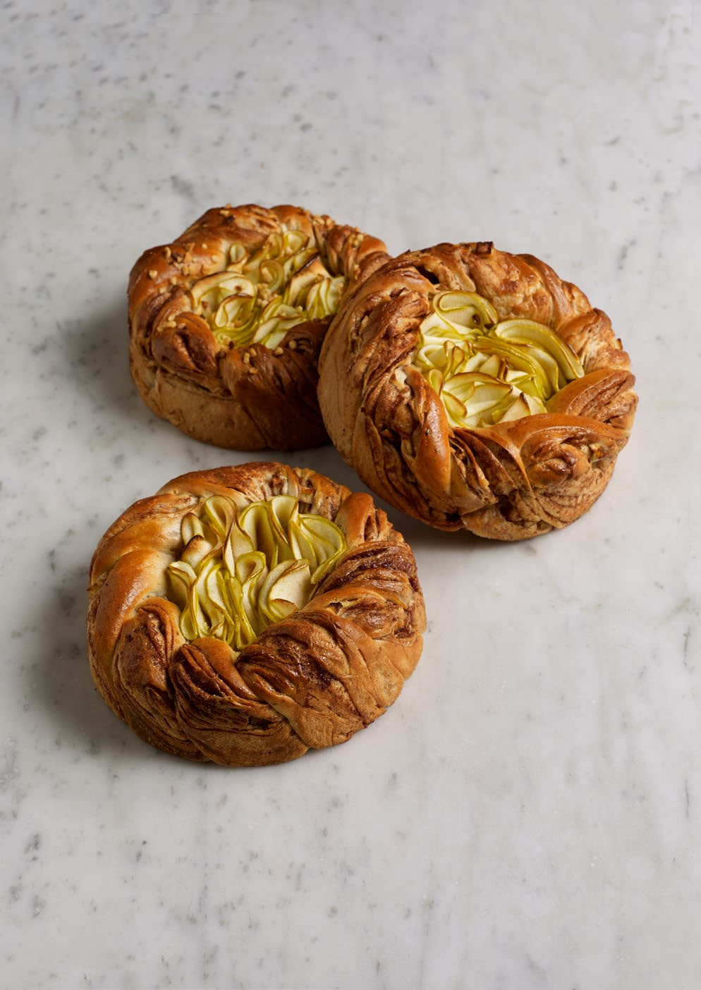 National Viennese 9.3 Apple/Cinnamon Äpple/Kanel Wheat dough with ground cardamom. The filling is apple and cinnamon. Rolled together and cut in half, twist and put a steel ring around.